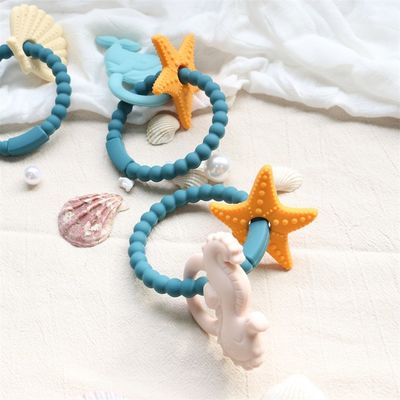 Dòng răng silicone cho trẻ em với thiết kế không độc hại và dễ cầm tay cầm và nhẫn răng silicone không chứa BPA