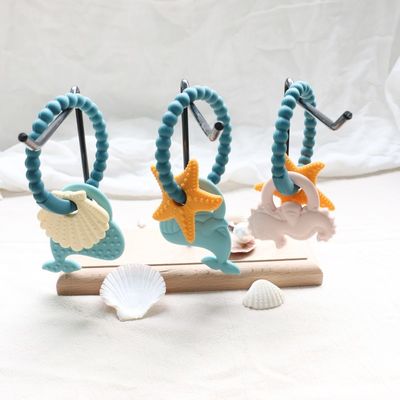 Dòng răng silicone cho trẻ em với thiết kế không độc hại và dễ cầm tay cầm và nhẫn răng silicone không chứa BPA